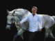 Working in-hand with Bailey, a Dutch Warmblood from the Netherlands, Chris demonstrates how to help a nervous horse relax with well-balanced movement.