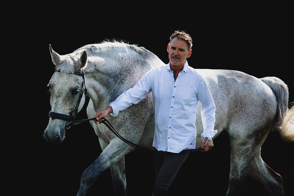 Working in-hand with Bailey, a Dutch Warmblood from the Netherlands, Chris demonstrates how to help a nervous horse relax with well-balanced movement. 