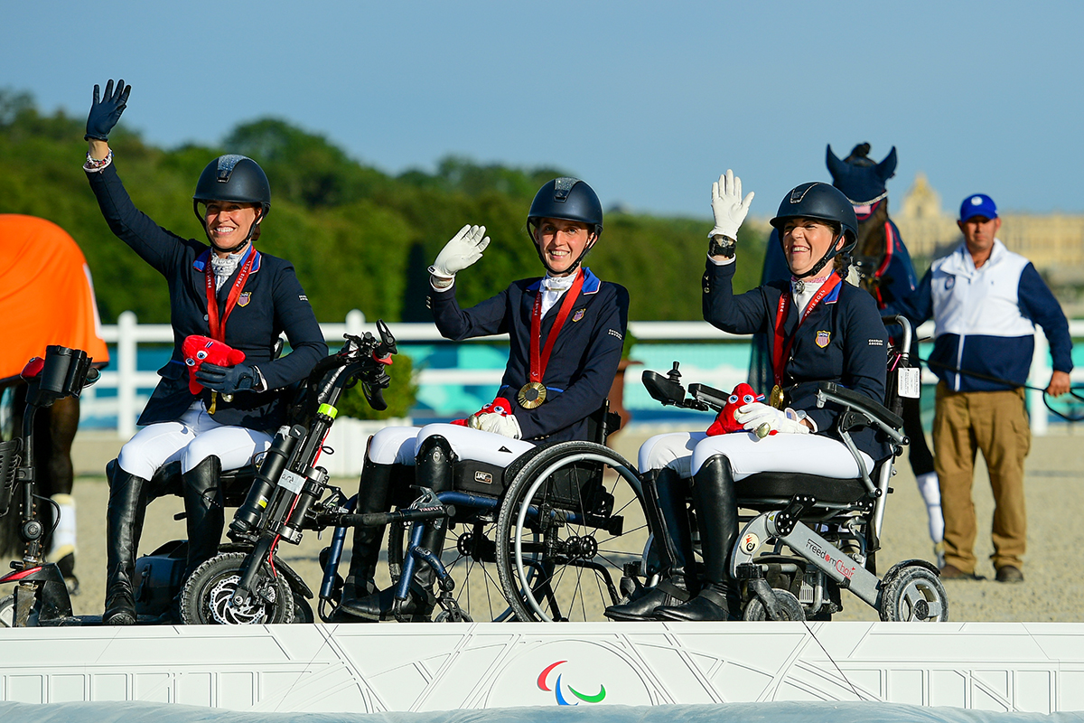 The gold-medal winning U.S. Para Dressage Team at the 2024 Paris Paralympics. From left to right: Rebecca Hart, Fiona Howard, and Roxanne Trunnell.