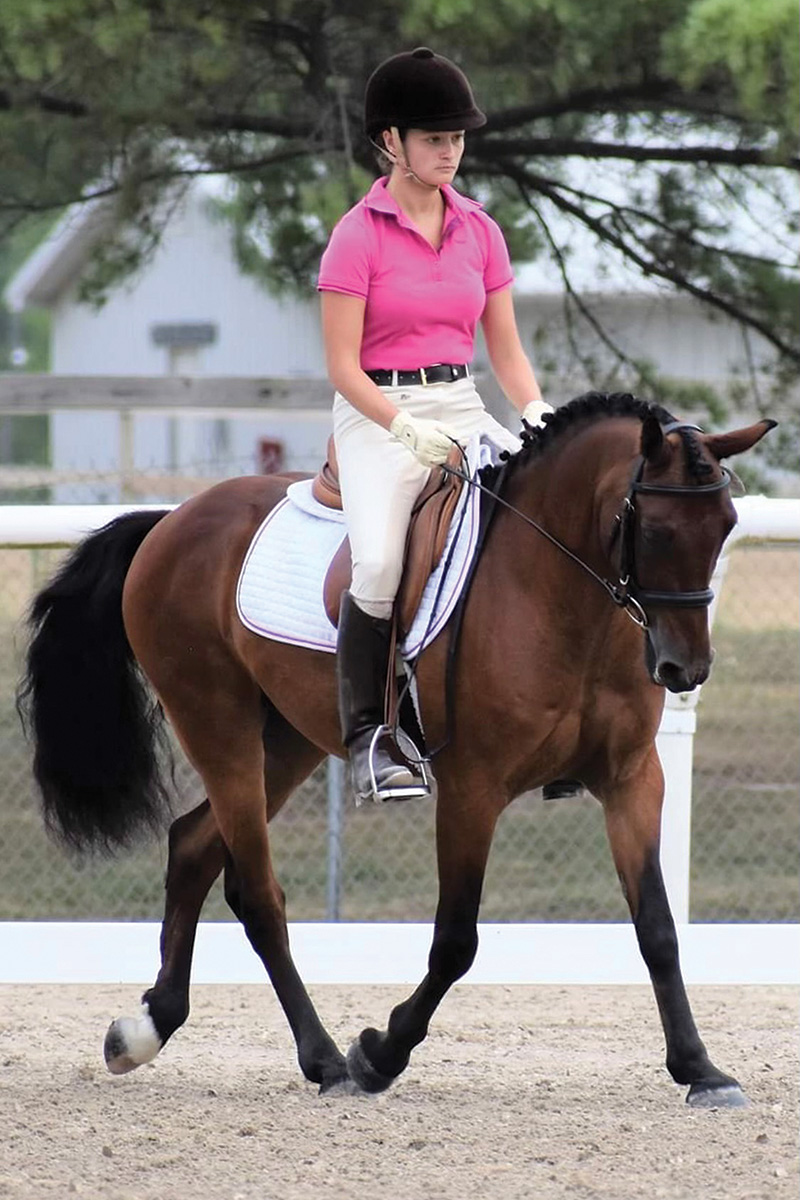 Carli riding her pony