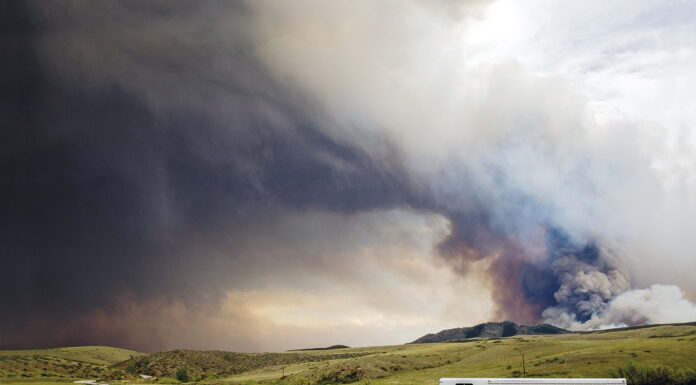 A horse trailer evacuating from a fire. Having a natural disaster or emergency preparedness plan helped these horse owners evacuate safely.