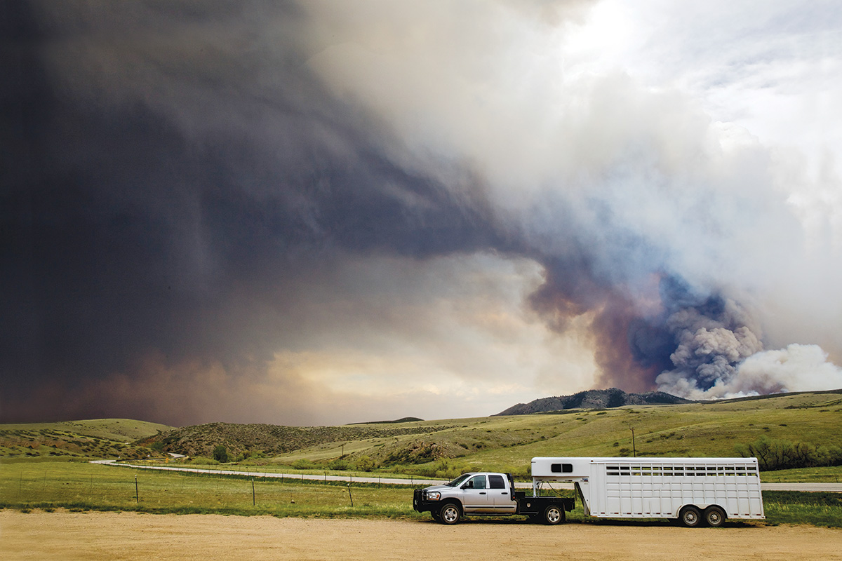 A horse trailer evacuating from a fire. Having a natural disaster or emergency preparedness plan helped these horse owners evacuate safely.