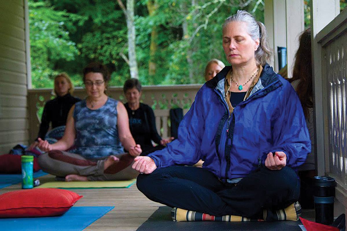 Equestrians practicing yoga that can be integrated into their horsemanship