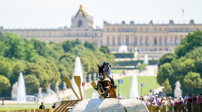 Laura Collett and London 52 on the 2024 Paris Olympics cross-country course with the Palace of Versailles setting the scene