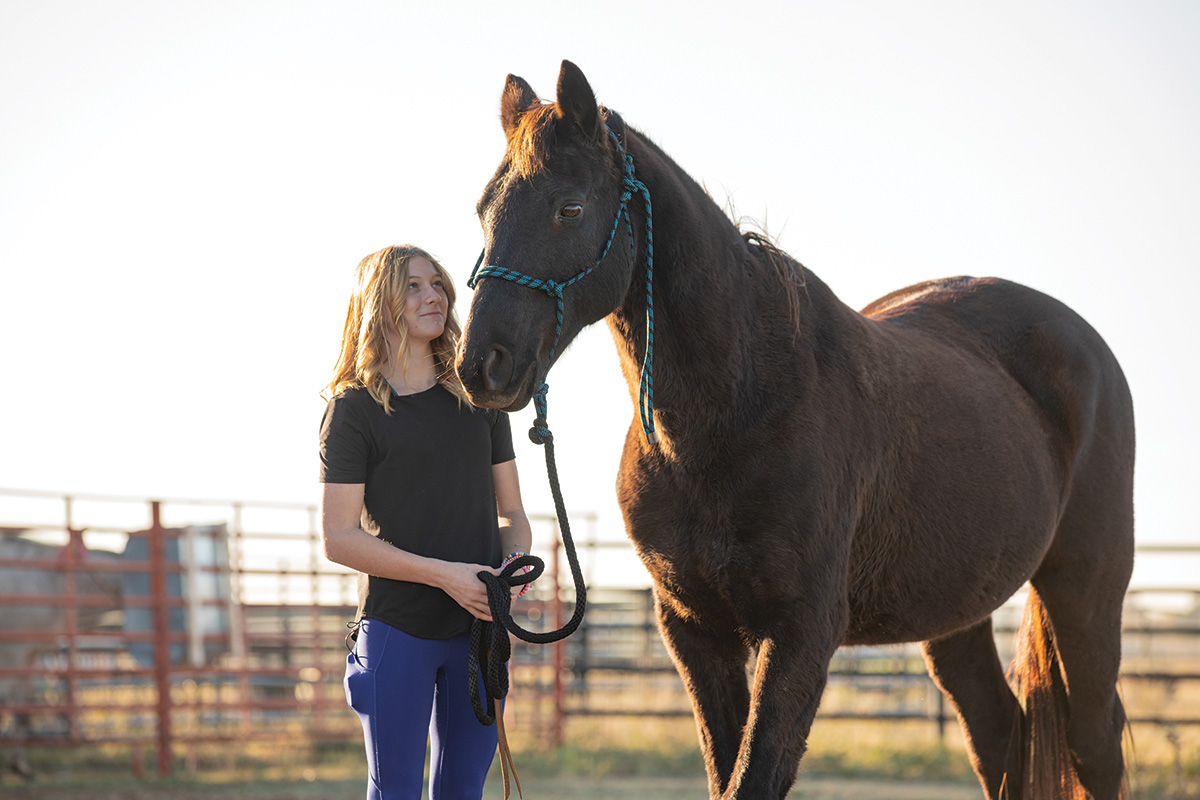 A young girl with her adopted horse