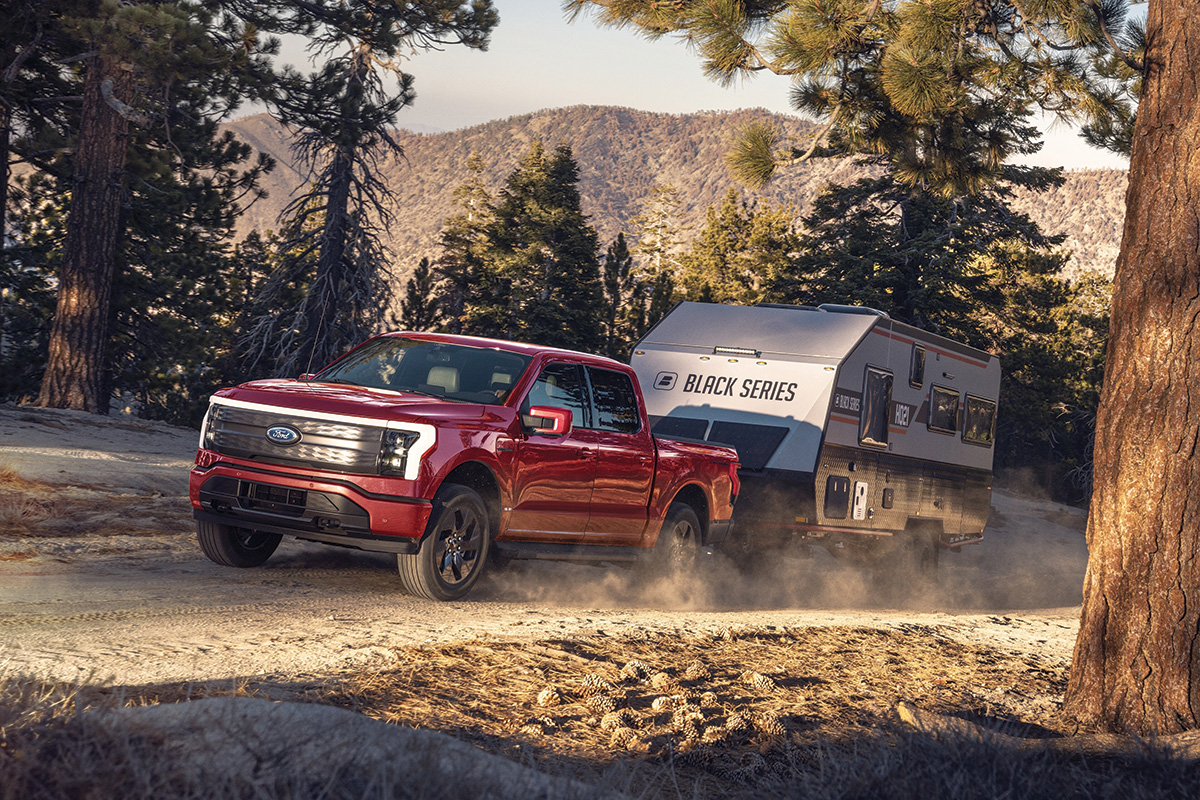 The electric Ford F-150 Lightning towing a camper