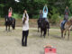 Riders practicing the Temple Pose at a yoga and horsemanship retreat