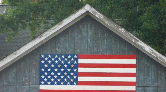 Horse barn with American flag