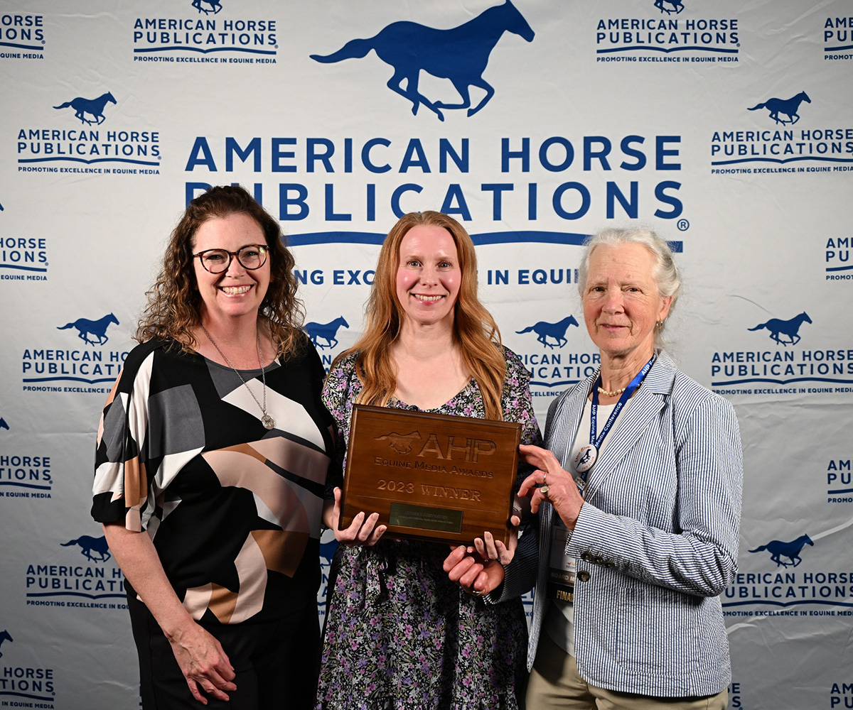 Horse Illustrated Editor in Chief Holly Caccamise (center) accepts an award from Barrie Reightler, AHP President