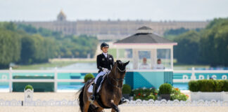 Jessica von Bredow-Werndl (GER) riding TSF Dalera BB during the Dressage Grand Prix Freestyle with the Palace of Versailles as the backdrop at the 2024 Paris Olympic Games