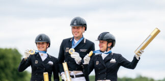 Germany's dressage team on the podium with their gold medals