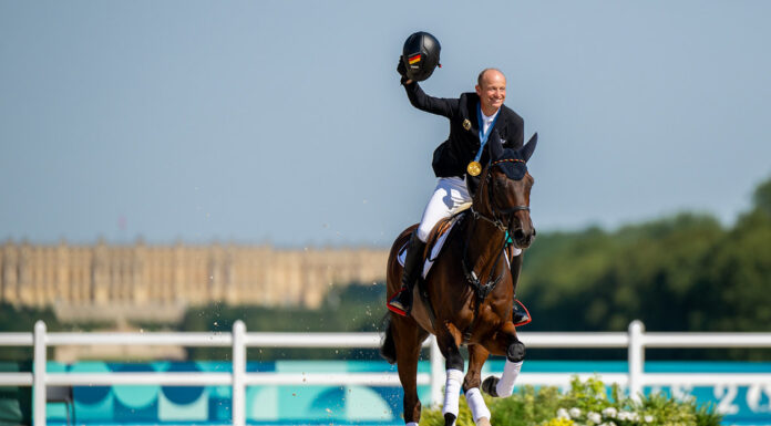 Michael Jung aboard Chipmunk FRH celebrates his history third individual gold medal in eventing