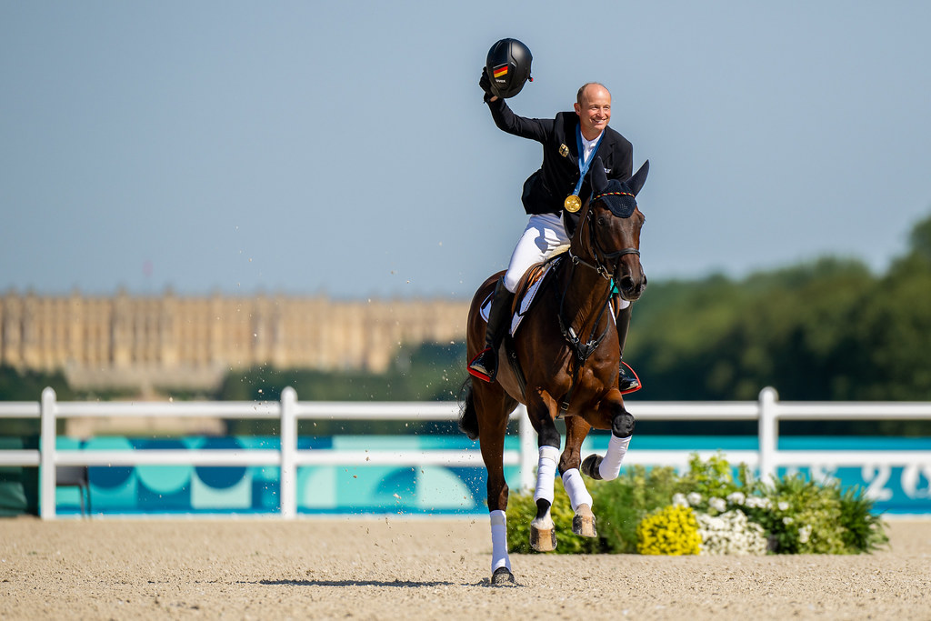 Michael Jung aboard Chipmunk FRH celebrates his historic third individual gold medal in eventing