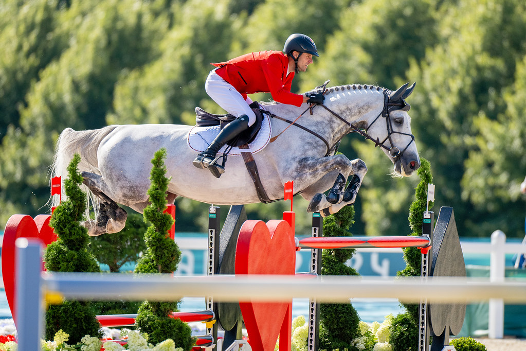 Christian Kukuk (GER) and Checker 47 soar over a jump during the Show Jumping Individual Final at the 2024 Paris Olympics