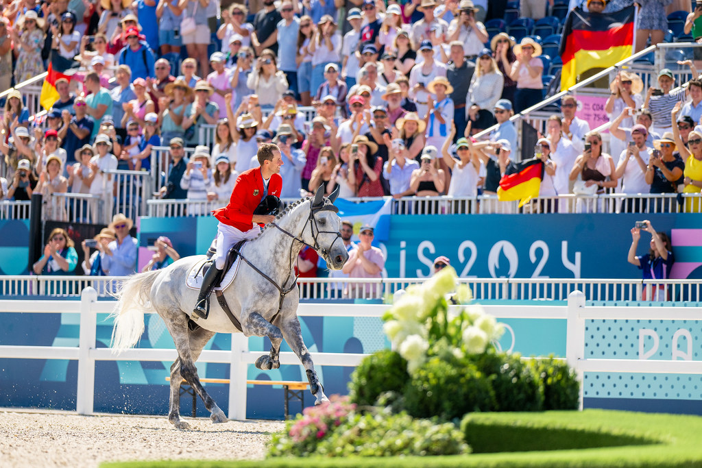 Kukuk and Checker 47 take their lap of honor after winning gold at the 2024 Paris Olympics in show jumping