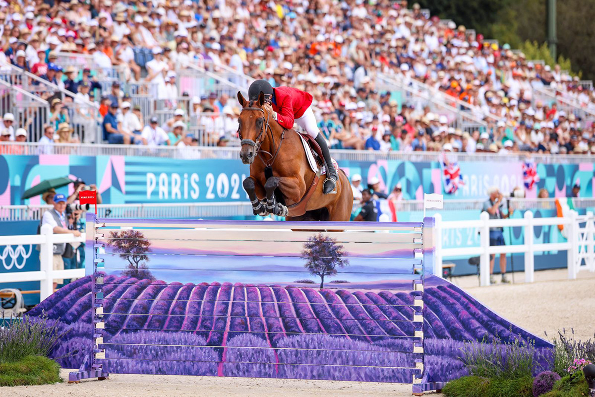 Karl Cook and Caracole de la Roque clear the lavender fields jump