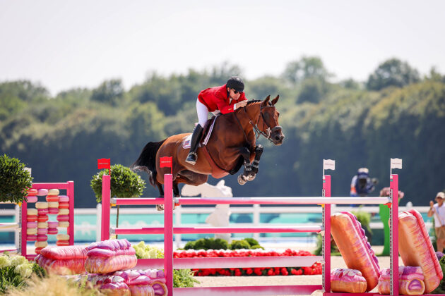 Karl Cook and Caracole de la Roque go clear in the Team Show Jumping Qualifier at the 2024 Paris Olympics