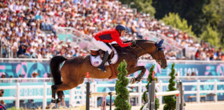 Laura Kraut and Baloutinue go clear in the team jumping qualifier at the 2024 Paris Olympics