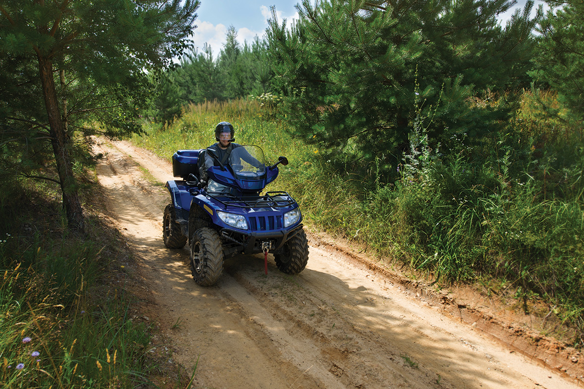 Riding an ATV in the woods