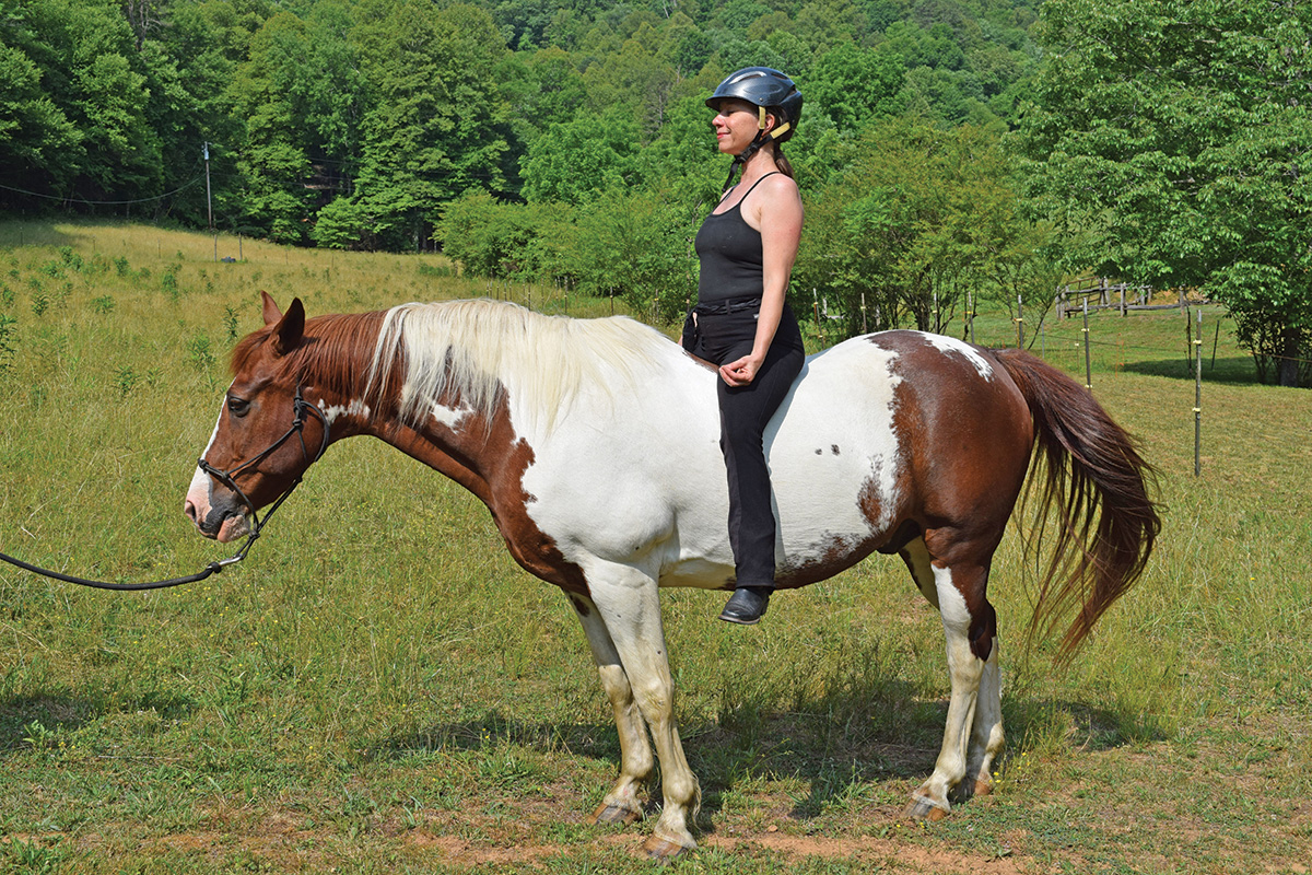 An equestrian integrating yoga with her horsemanship