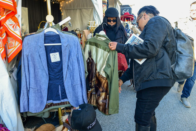 Shoppers admire a jacket in the 2024 Maryland Five Star Trade Fair