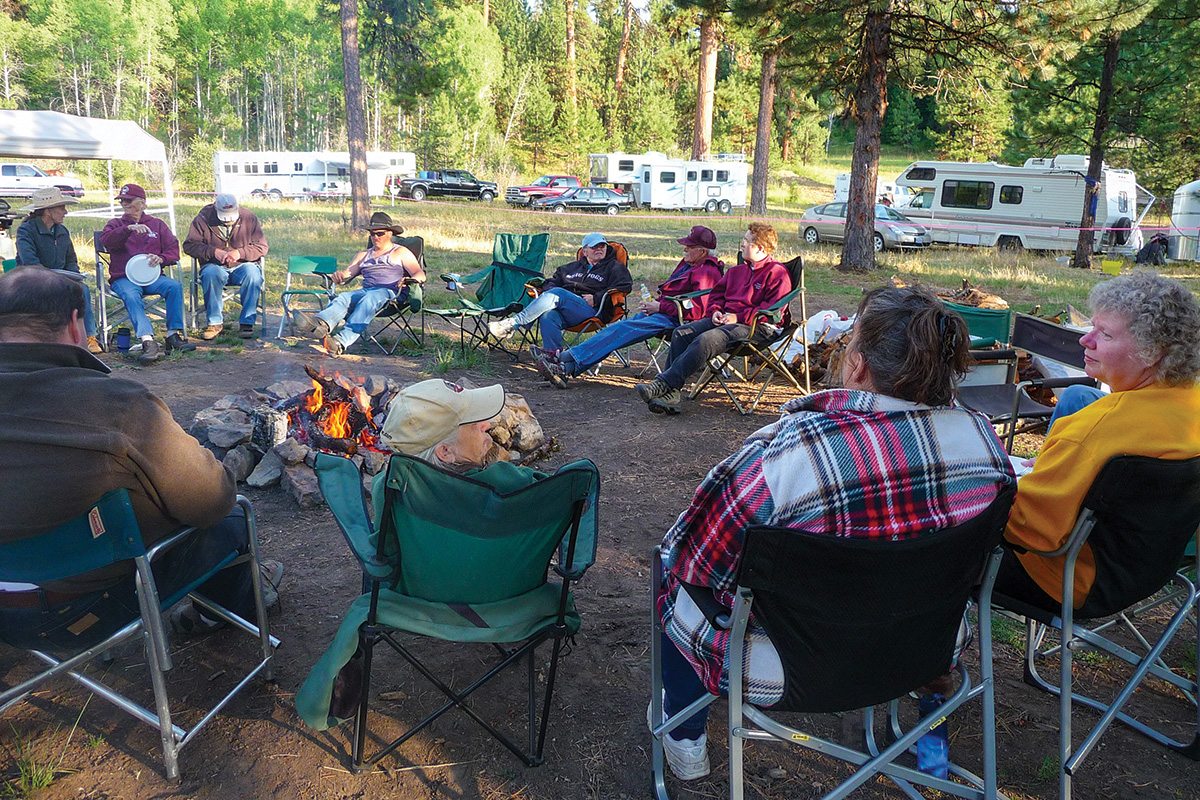 A group of people camping with horses