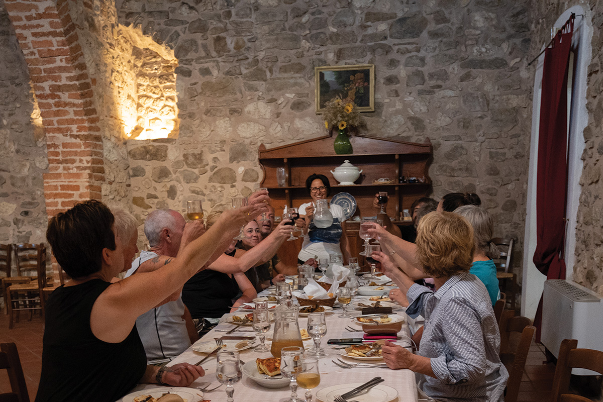 The group cheers at dinner