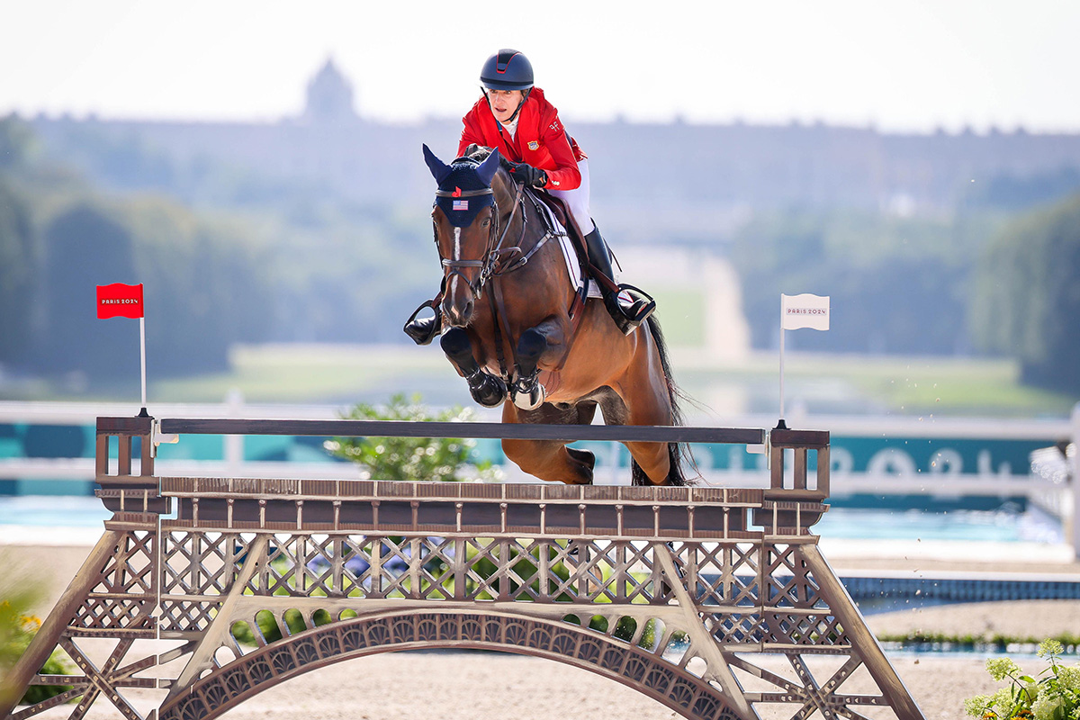 Laura Kraut (USA) and Baloutinue clear the Eiffel Tower jump with the backdrop of Palace of Versailles — a summary of the Paris 2024 Olympic equestrian setting