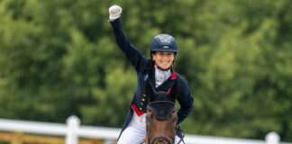 Laura Collett celebrates aboard London 52 after setting an Olympic record with a score of 17.5 in eventing dressage during equestrian sport