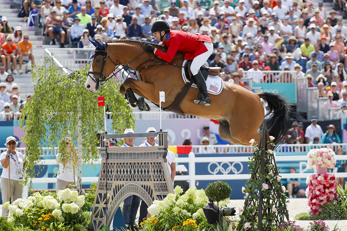 McLain Ward and Ilex soar over the Eiffel Tower jump during the Show Jumping Team Final at the 2024 Paris Olympics