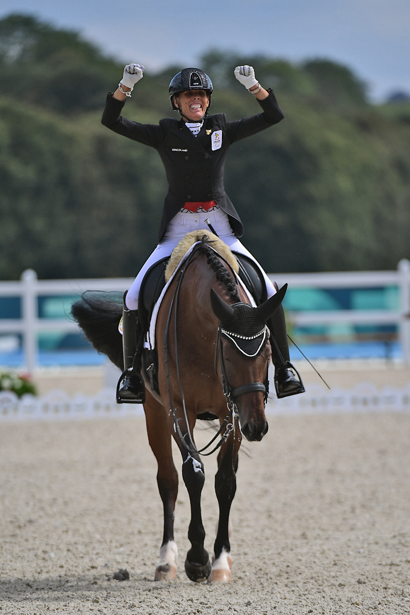 Michele George celebrates gold in Individual Grade V Para Dressage aboard Best of 8 at the Paris 2024 Paralympics