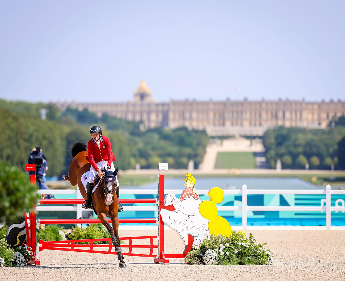 Boyd Martin and Fedarman B go double clear in both show jumping rounds to be the highest placed U.S. rider in eventing at the 2024 Paris Olympics with the Palace of Versailles in the background