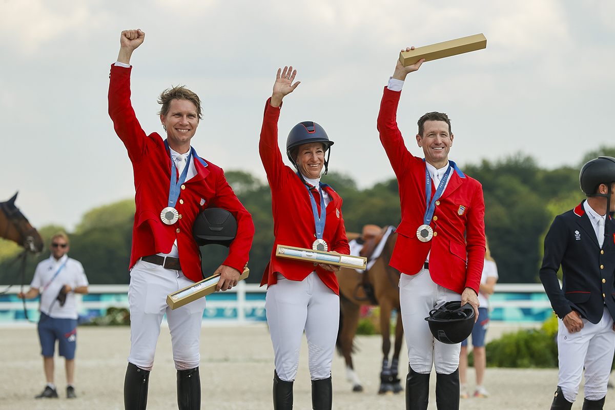 The U.S. silver medal show jumping team on the Paris 2024 Olympic podium